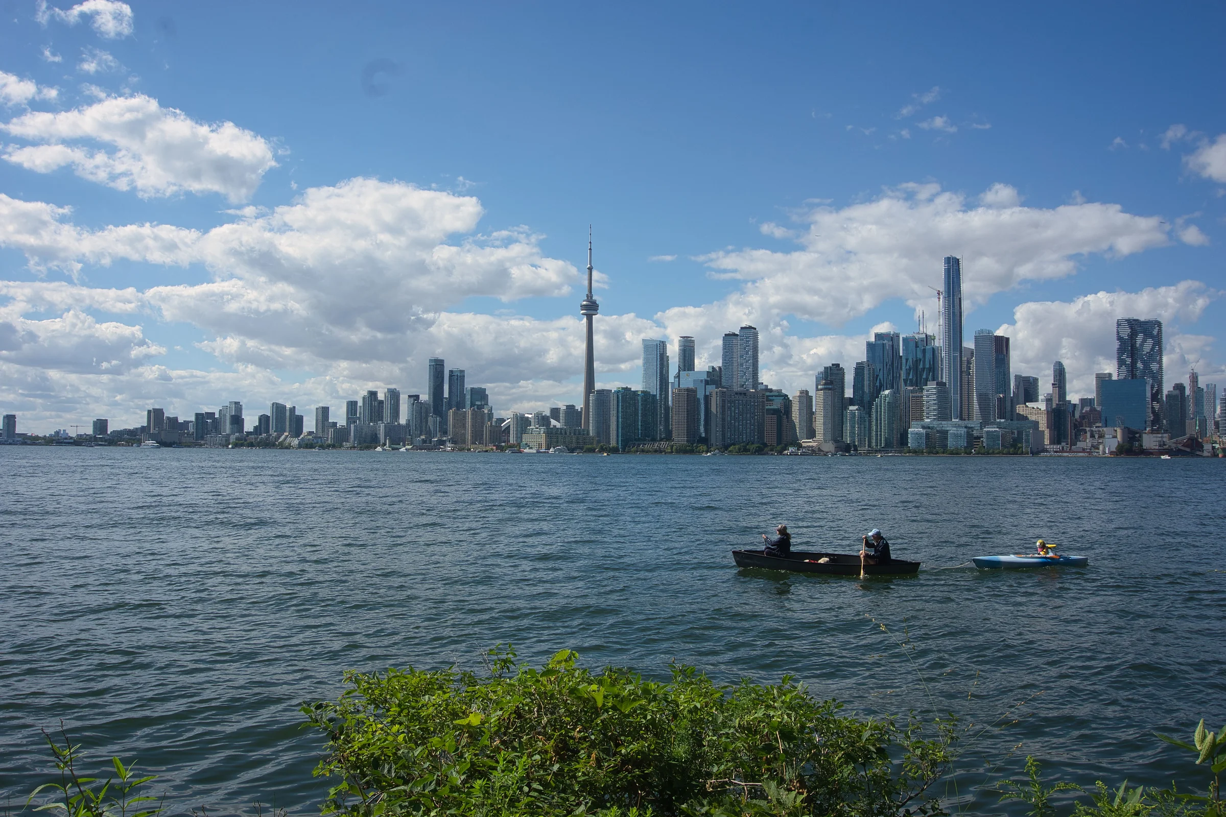 Toronto skyline across Lake Ontario with kayakers
